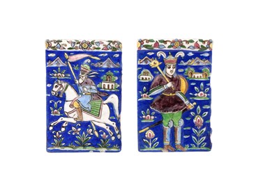 Lot 295 - TWO QAJAR POLYCHROME-PAINTED AND MOULDED POTTERY TILES