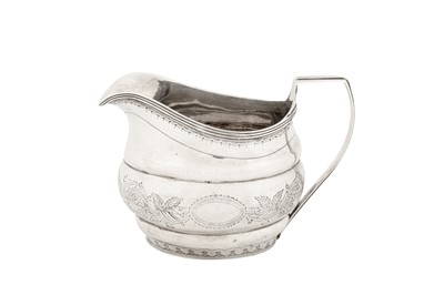 Lot 399 - A George III Irish provincial silver milk jug, Cork circa 1790 by Samuel Green