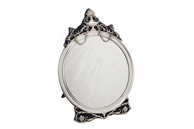 Lot 49 - An Edwardian sterling silver mounted dressing table mirror, London 1909 by William Comyns
