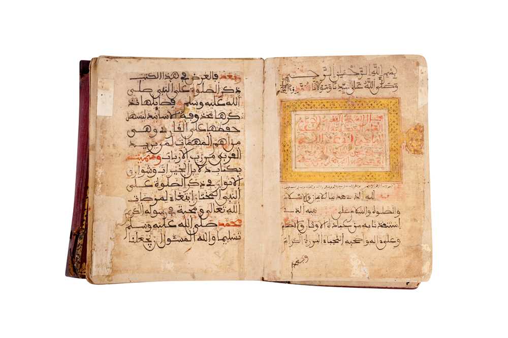 Lot 382 - AN ILLUMINATED MAGHRIBI MANUSCRIPT WITH PRAYERS AND QURANIC VERSES