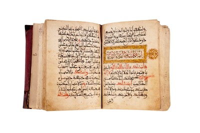 Lot 382 - AN ILLUMINATED MAGHRIBI MANUSCRIPT WITH PRAYERS AND QURANIC VERSES