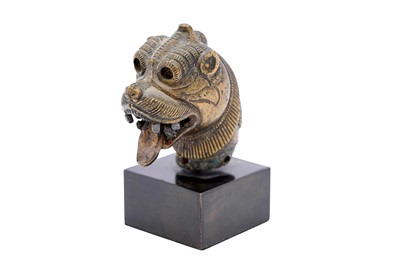 Lot 247 - A SINHA (LION) HEAD BRONZE FINIAL