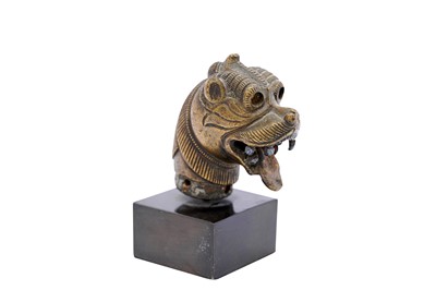 Lot 247 - A SINHA (LION) HEAD BRONZE FINIAL