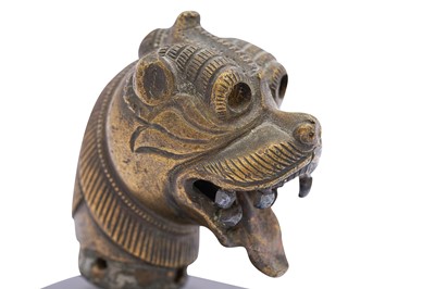 Lot 247 - A SINHA (LION) HEAD BRONZE FINIAL