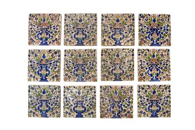 Lot 294 - EIGHTEEN QAJAR POLYCHROME-PAINTED DECORATIVE ARCHITECTURAL POTTERY TILES