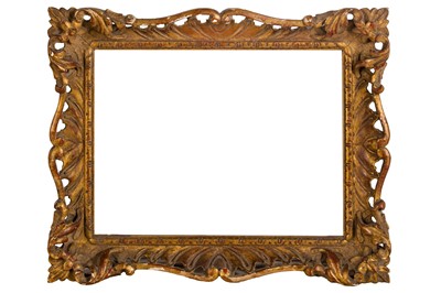 Lot 207 - AN ENGLISH CARVED AND GILDED ROCOCO STYLE SWEPT AND PIERCED FRAME