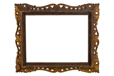 Lot 207 - AN ENGLISH CARVED AND GILDED ROCOCO STYLE SWEPT AND PIERCED FRAME
