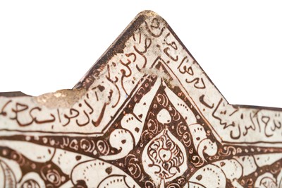 Lot 277 - A COPPER LUSTRE-PAINTED POTTERY STAR TILE FRAGMENT