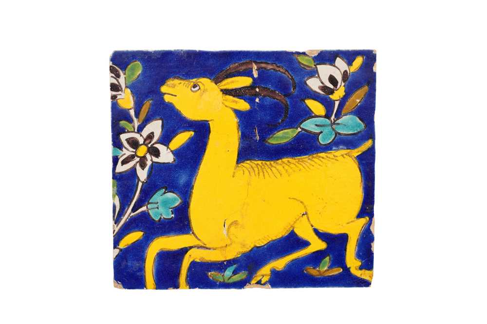 Lot 285 - A SAFAVID CUERDA SECA POTTERY TILE WITH A GOITERED GAZELLE