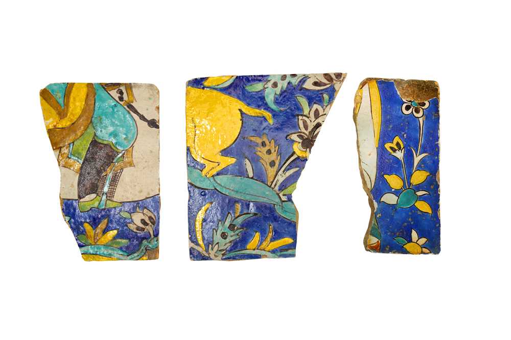 Lot 286 - THREE FRAGMENTS OF SAFAVID CUERDA SECA POTTERY TILES WITH FIGURAL MOTIFS