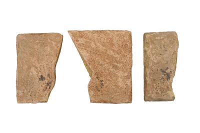 Lot 286 - THREE FRAGMENTS OF SAFAVID CUERDA SECA POTTERY TILES WITH FIGURAL MOTIFS