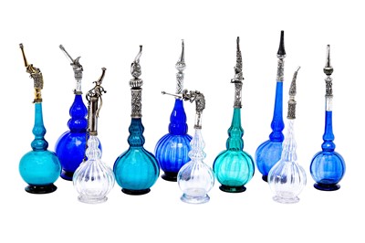 Lot 192 - AN IMPRESSIVE GROUP OF ELEVEN MUGHAL MOULD-BLOWN GLASS ROSEWATER SPRINKLERS WITH SILVER MOUNTS
