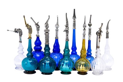 Lot 192 - AN IMPRESSIVE GROUP OF ELEVEN MUGHAL MOULD-BLOWN GLASS ROSEWATER SPRINKLERS WITH SILVER MOUNTS