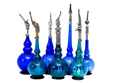 Lot 192 - AN IMPRESSIVE GROUP OF ELEVEN MUGHAL MOULD-BLOWN GLASS ROSEWATER SPRINKLERS WITH SILVER MOUNTS