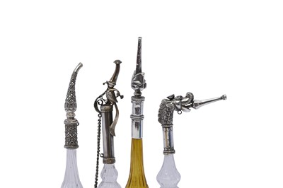 Lot 192 - AN IMPRESSIVE GROUP OF ELEVEN MUGHAL MOULD-BLOWN GLASS ROSEWATER SPRINKLERS WITH SILVER MOUNTS