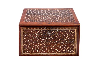 Lot 233 - λ A SMALL INDO-PORTUGUESE CARVED ROSEWOOD IVORY-INLAID PORTABLE TABLE CABINET (VARGUENO)