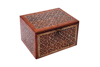 Lot 233 - λ A SMALL INDO-PORTUGUESE CARVED ROSEWOOD IVORY-INLAID PORTABLE TABLE CABINET (VARGUENO)