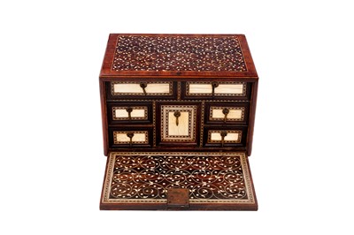 Lot 233 - λ A SMALL INDO-PORTUGUESE CARVED ROSEWOOD IVORY-INLAID PORTABLE TABLE CABINET (VARGUENO)