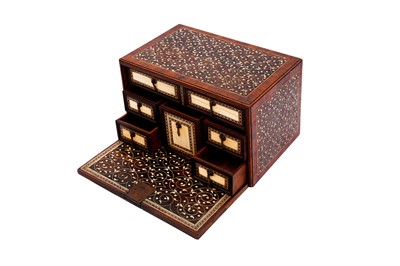 Lot 233 - λ A SMALL INDO-PORTUGUESE CARVED ROSEWOOD IVORY-INLAID PORTABLE TABLE CABINET (VARGUENO)