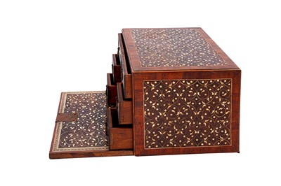 Lot 233 - λ A SMALL INDO-PORTUGUESE CARVED ROSEWOOD IVORY-INLAID PORTABLE TABLE CABINET (VARGUENO)
