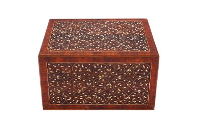 Lot 233 - λ A SMALL INDO-PORTUGUESE CARVED ROSEWOOD IVORY-INLAID PORTABLE TABLE CABINET (VARGUENO)