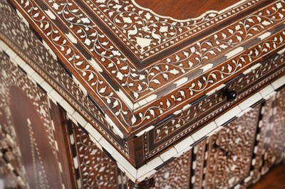 Lot 213 - λ A CARVED HARDWOOD ANGLO-INDIAN IVORY AND EBONY-INLAID DAVENPORT DESK WITH VEGETAL DESIGNS