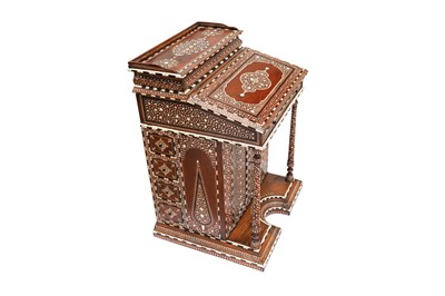 Lot 213 - λ A CARVED HARDWOOD ANGLO-INDIAN IVORY AND EBONY-INLAID DAVENPORT DESK WITH VEGETAL DESIGNS