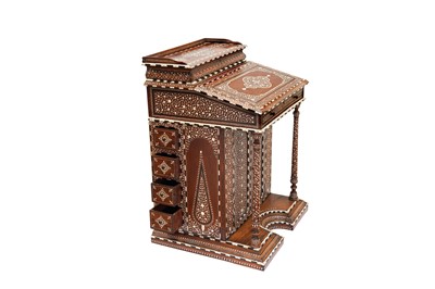 Lot 213 - λ A CARVED HARDWOOD ANGLO-INDIAN IVORY AND EBONY-INLAID DAVENPORT DESK WITH VEGETAL DESIGNS