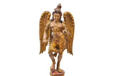 Lot 107 - A CARVED WOODEN GILT AND POLYCHROME-PAINTED STATUE OF A WINGED APSARA