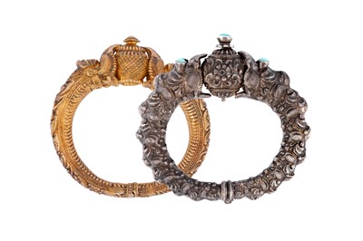 Lot 246 - TWO 'MAKARA HEAD' SILVER BANGLES (KADA)