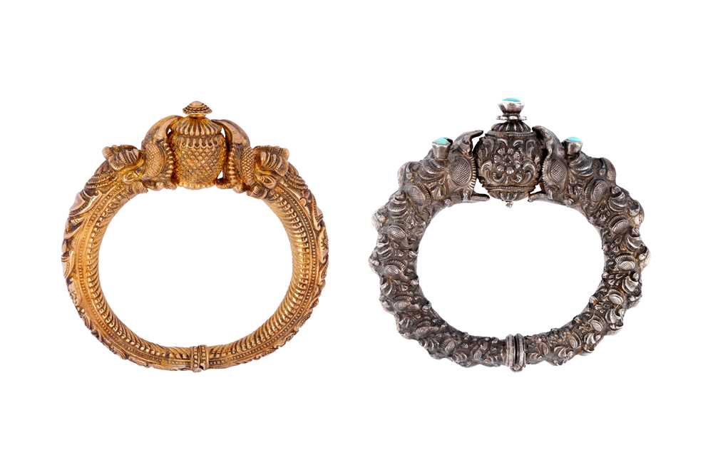 Lot 246 - TWO 'MAKARA HEAD' SILVER BANGLES (KADA)