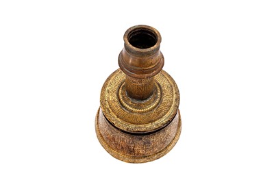 Lot 365 - AN IMPRESSIVE LARGE MAMLUK ENGRAVED BRASS CANDLESTICK WITH THE SCRIBE INSIGNIA