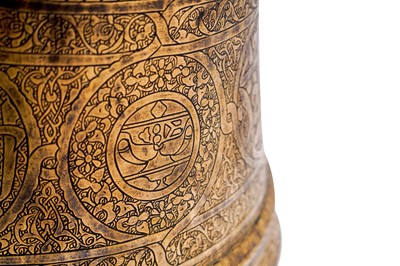 Lot 365 - AN IMPRESSIVE LARGE MAMLUK ENGRAVED BRASS CANDLESTICK WITH THE SCRIBE INSIGNIA