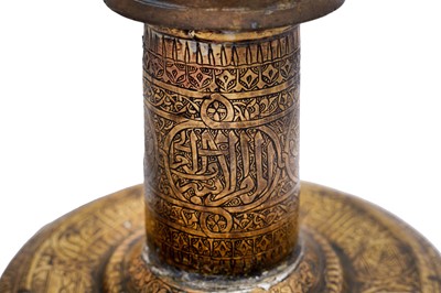 Lot 365 - AN IMPRESSIVE LARGE MAMLUK ENGRAVED BRASS CANDLESTICK WITH THE SCRIBE INSIGNIA