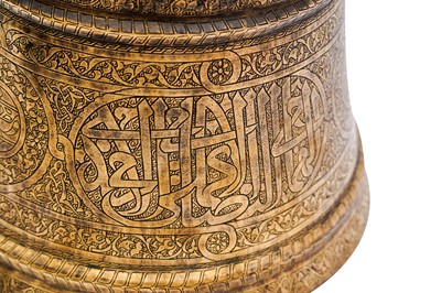 Lot 365 - AN IMPRESSIVE LARGE MAMLUK ENGRAVED BRASS CANDLESTICK WITH THE SCRIBE INSIGNIA