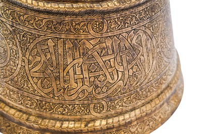 Lot 365 - AN IMPRESSIVE LARGE MAMLUK ENGRAVED BRASS CANDLESTICK WITH THE SCRIBE INSIGNIA