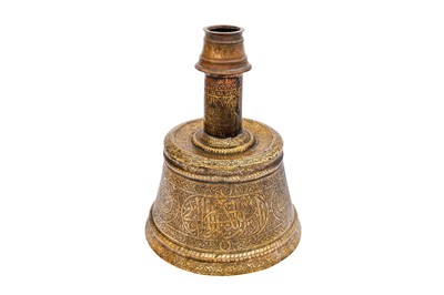 Lot 365 - AN IMPRESSIVE LARGE MAMLUK ENGRAVED BRASS CANDLESTICK WITH THE SCRIBE INSIGNIA