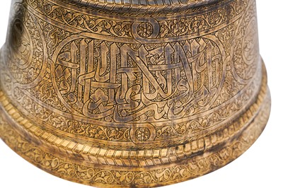 Lot 365 - AN IMPRESSIVE LARGE MAMLUK ENGRAVED BRASS CANDLESTICK WITH THE SCRIBE INSIGNIA