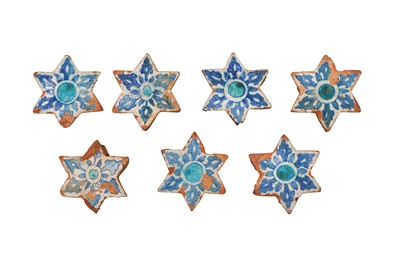 Lot 270 - SEVEN SIX-POINTED ARCHITECTURAL STAR-SHAPED BLUE AND WHITE POTTERY TILES