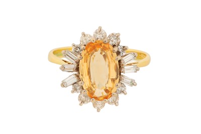 Lot 186 - A TOPAZ AND DIAMOND RING