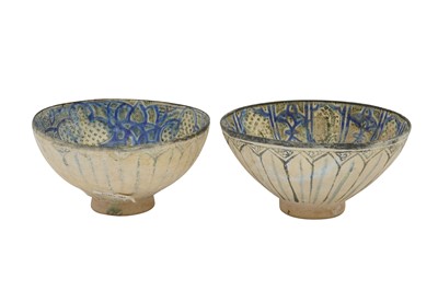 Lot 20 - TWO SULTANABAD POTTERY BOWLS WITH CALLIGRAPHY AND VEGETAL MOTIFS