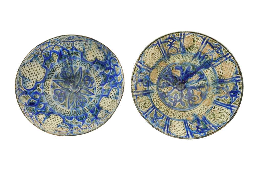 Lot 20 - TWO SULTANABAD POTTERY BOWLS WITH CALLIGRAPHY AND VEGETAL MOTIFS