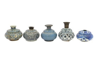 Lot 25 - FIVE SMALL ASIAN-INSPIRED SAFAVID BLUE AND WHITE POTTERY VASES