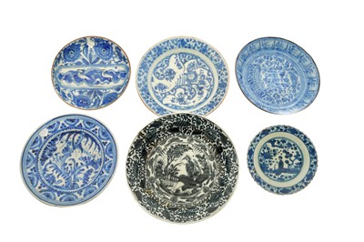 Lot 72 - SIX ASIAN-INSPIRED BLUE AND WHITE POTTERY DISHES WITH FIGURAL AND VEGETAL MOTIFS