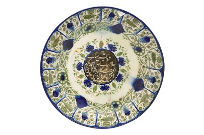 Lot 67 - A LARGE QAJAR GREEN AND COBALT BLUE POTTERY SERVING DISH