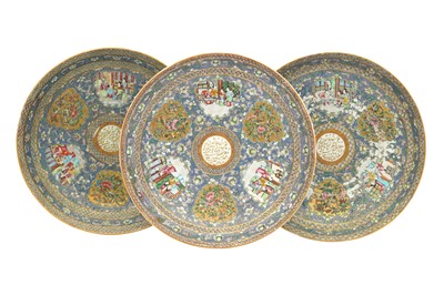 Lot 79 - THREE LARGE CANTON 'FAMILLE ROSE' PORCELAIN DISHES FROM THE ZILL AL-SULTAN'S "BLUE SERVICE"