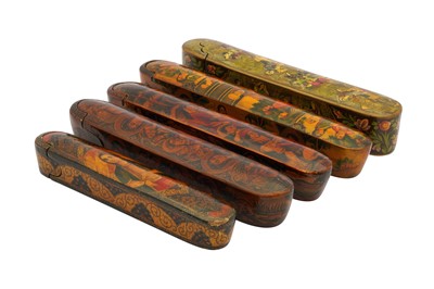 Lot 48 - FIVE LACQUERED PAPIER-MÂCHÉ PEN CASES (QALAMDAN) WITH QAJAR MAIDENS AND GROUP GATHERINGS