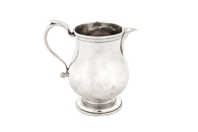 Lot 405 - An early George II provincial sterling silver cream jug, Newcastle 1728 by Isaac Cookson (free. 1728, d. 1754)