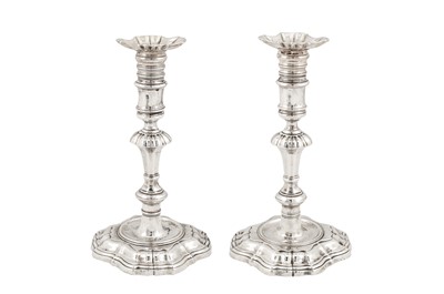 Lot 454 - A pair of George II sterling silver candlesticks, London 1742 by James Gould