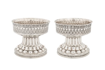 Lot 335 - A pair of Edwardian sterling silver replica of the Holms Cup bowls, Chester 1906 by Nathan and Hayes
